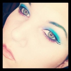 purple and blue eyeshadow with pink underneath black and white eyeliner