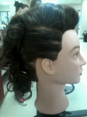 I styled this after a roller set into this cute mohawk-like retro hair-do. Done in my cosmetology class. :)