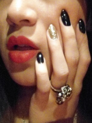 red lips and nails black and Gold