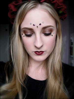 Decorated around the eyes with Sacred Stones by Illamasqua made by Swarovski from the Sacred Hour collection