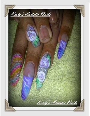 One of my clients real nails, I did acrylic art work and airbrush design on.