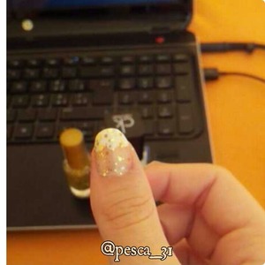 eggshell french with some gold glitter 