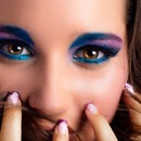 Young model with pastel eye shadows and fashion manicure 