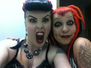 I'm the girl to your left rockin my pin up Bettie bump bangs all my own hair with no "added rat" and my friend made all of her own dreaded extensions. This was just a fun time needing manic facial expressions via photo! Enjoy and check out my page:http://www.facebook.com/pandorathemakeupexplora 