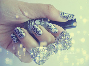 so get silver   nail polish and get a stencil to make cheetah prints out of any color and get a dimond bow