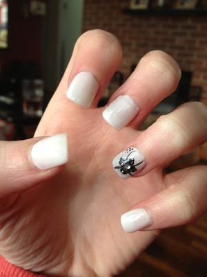 Black flower- white nails. 