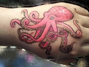 Pink octopus on my hand in all eye shadow and makeup medium.