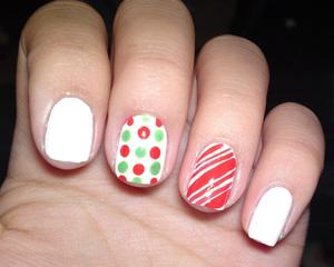 This is a nail design I rocked on the month of Christmas. Candy cane and polka-dots.