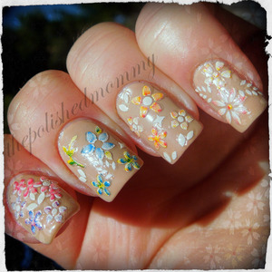 February Nail Art Challenge: Nude Polish. http://www.thepolishedmommy.com/2013/02/streaking-through-flowers.html 
Flowers stickers available at bornprettystore.com and use the code NKL91 for 10% off your order and free shipping worldwide!