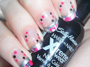 Grade 9 semi formal nails 2012 <3

For this design I used:
 Sally Hansen Xtreme Wear- White On (base on tips)
 Sally Hansen Xtreme Wear- Celeb City (water marble)
 Sally Hansen Xtreme Wear- Black Out (water marble, black dots)
 Sally Hansen Xtreme Wear- Hot Magenta (water marble, pink dots)
 China Glaze- Fairy Dust (base glitter)
 Wet N' Wild- Kaleidoscope (base glitter)
 L.A. Colours Art Deco- Silver (silver stripe)