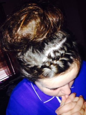 Simple messy bun with a tight plat 