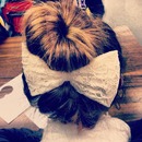 Upside down braid into bun with bow 