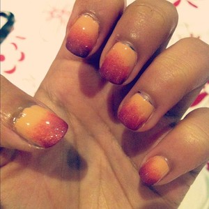 3simple colours layered to make something akin to a sunset on my nails ^^