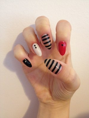 Natural stiletto nails with free hand painted stripes 