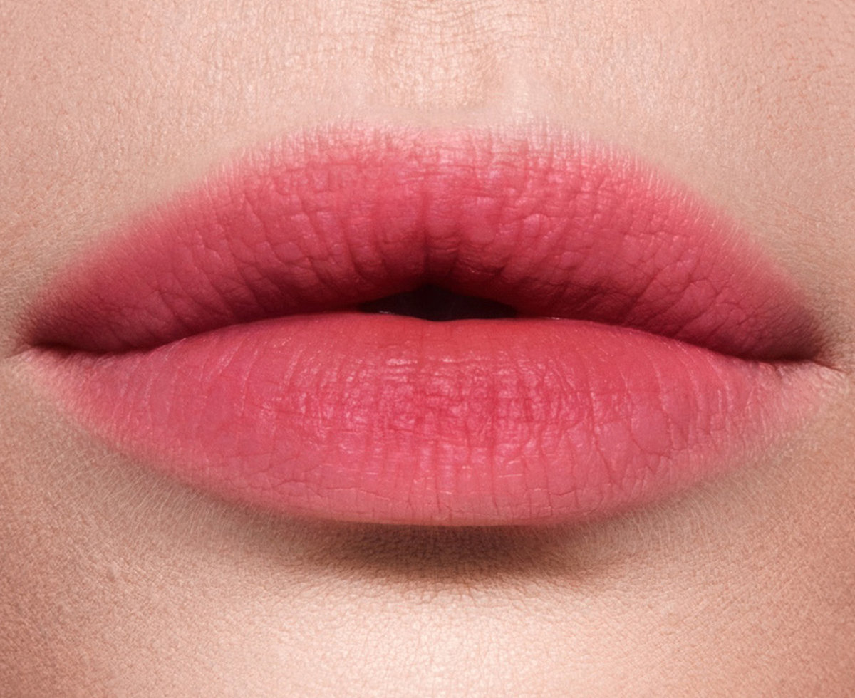 Charlotte Tilbury lip model wearing Rose Blur blurred