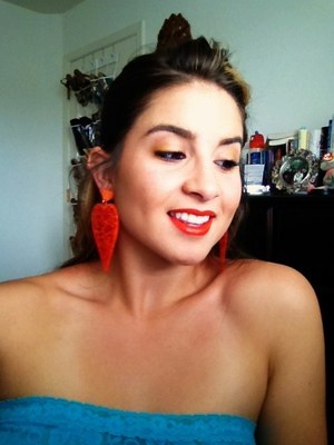 My friend got these earrings for me in Italy, she says it's the "hottest fad there!" I don't know how I like them, but they match my lipstick well!  