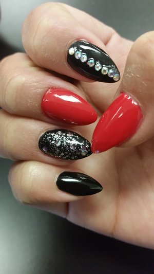 red and black nails with glitter and rhinestones 
