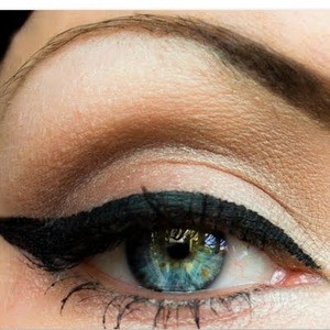 Just Liguid Cat Eye Black Liner with just a little brown shadow for the corner to darken it up to make it look natural.
