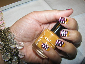 Brucci Nail Hardener  in "Jan's Jazzy Ginger " 
Check Out My Video Tutorial On How to Create this Look 
http://www.facebook.com/YennyStorytale  