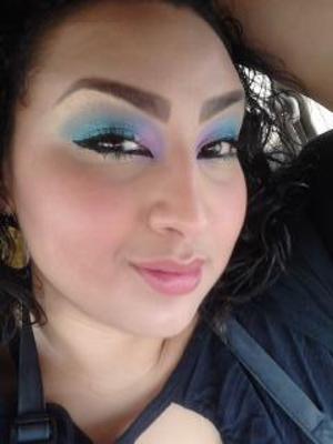 Purple eye shadow in the corner blended into blue with gold under brow bone blended into the blue as well. 
