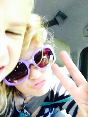 This is me and HUGE sunglasses and the face of the ther person is my little bro, peace out!