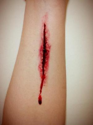 Check out my tutorial on how to create this
http://www.stepfordwitch.com/2012/10/sfx-tutorial-blood-and-gore-for.html