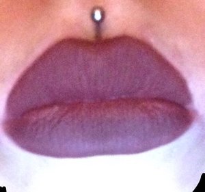 Lip line the lips with avon , color chocolate . Then finish with jordana color ( eggplant ) 