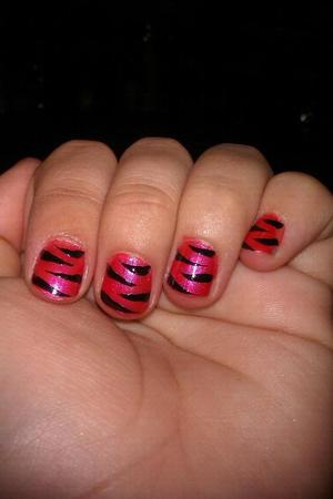 Tiger print nails .