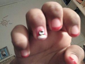 (Kinda Blurry) Angry Bird on ring finger, with red tips on the rest to make it stand out.