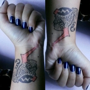 jeslyn on blue, drawing pen at tattoo. 