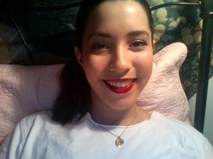 NARS Semi-Matte Red Lizard lips covered with a gloss I can't remember.