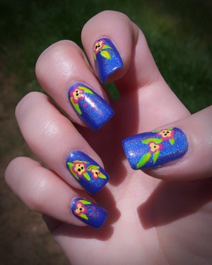 Tropical Floral Holographic Nails

First time doing a nail kit with a combination of brush-on gel and acrylic dipping. 