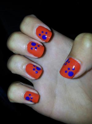 These are the nails I did for the OFSAA West Regionals Track Meet (I know it seems silly but my whole 4x100m team had matching nails and hair and spandex shorts). I'm proud to support my school in my favourite way, nail art. 

For this design I used:

Essie- Orange It's Obvious (base)
Essie- Mesmerize (paw print)
