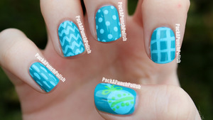 The blue is Sinful Colors Savage and the designs are done with acrylic paint.

http://packapunchpolish.blogspot.com/2012/09/simple-baby-shower-nail-art.html