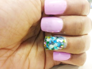 Pastel Pink with a hint of Purple Nail Polish  and a light blue tinted glittery circle clusters 