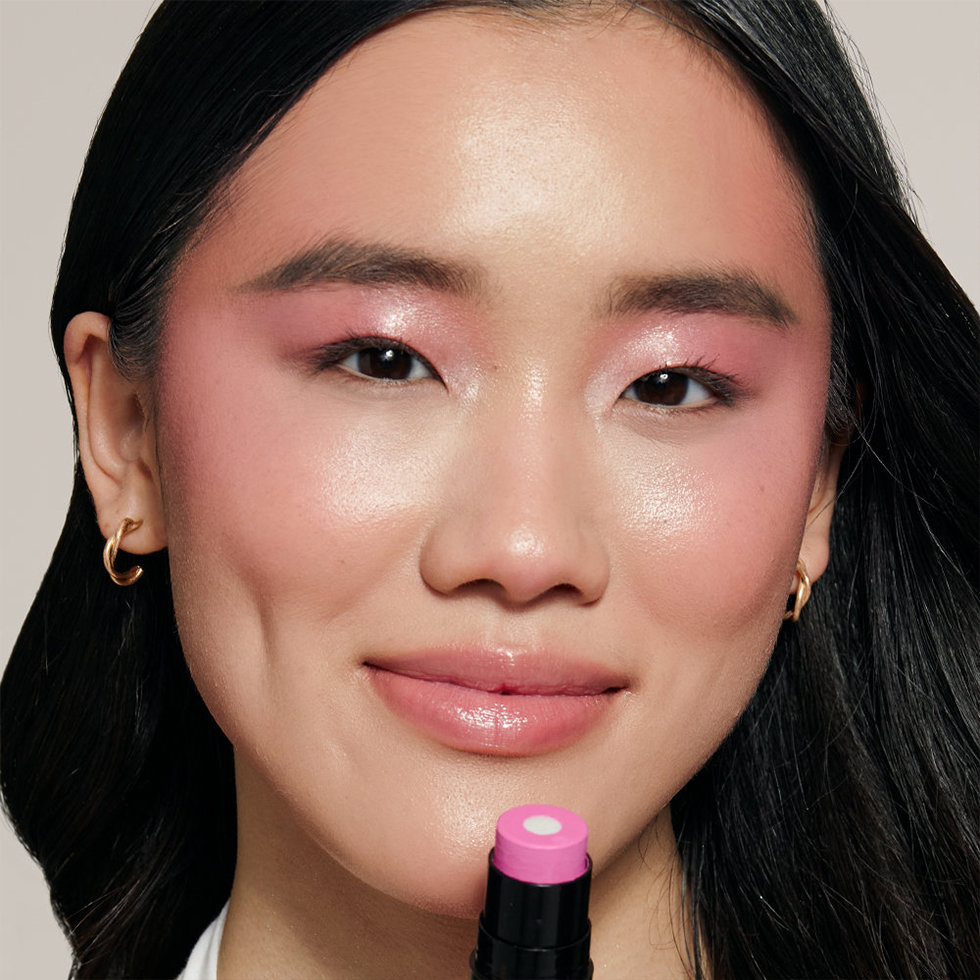 Nudestix model wearing the Nudies Matte + Glow Core in Magenta Magic