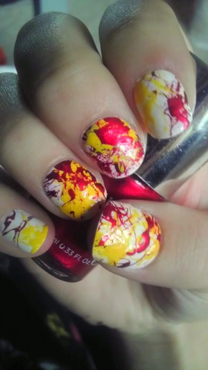 Sorry about the quality, it was taken with my phone. 

Anyways, our school colors are red and gold so I decided to do a "Back-To-School-Friday-Night-Football" mani :) 
