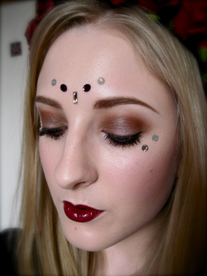 Decorated around the eyes with Sacred Stones by Illamasqua made by Swarovski from the Sacred Hour collection