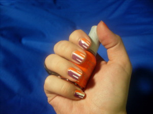 I really wanted to use this orange :D
-Orly Nail Lacquer in Orange Punch 
-OPI nail polish in Pamplona Purple
-Orly instant artist in Crisp White