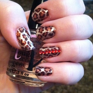 Leopard print with red rhinestones.
