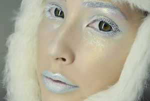 Ice Queen: Used tako and mochi pressed shadows by Sugarpill Cosmetics on the eyes and lips, then NARS Cosmetics highlight in Albatross! Under the eyes and on all my highlight points I used LORAC Cosmetics, Inc. 3D liquid lustre in diamond! To make my lashes white I just used the white from my MAKE UP FOR EVER flash color palette! And then just some white cosmetic glitter on the brows and lips. OH and I used a stick on bejeweled winged liner by Salon-Perfect.ro (Bought it at Walmart when they had this set up for Halloween!)
