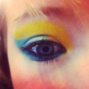 Blue and yellow eye shadow with a bit of mascara and eyeliner.