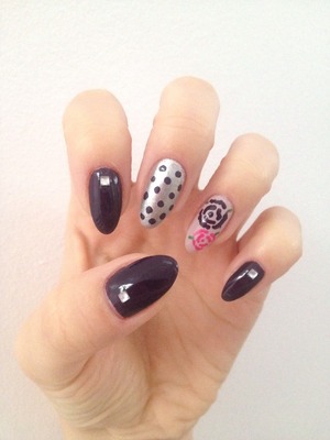 Natural stiletto nails with gems and free hand drawn dots and roses
