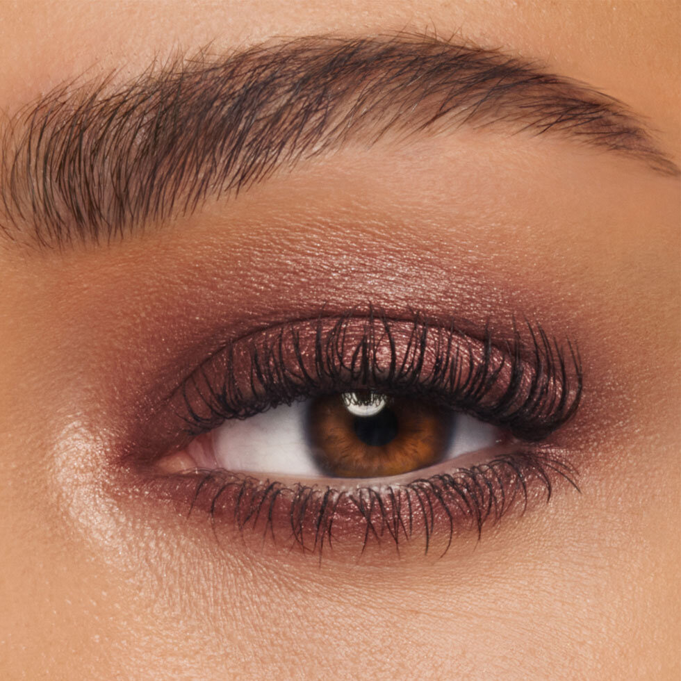 Charlotte Tilbury model wearing the Exagger-Eyes Waterproof Eyeshadow Stick in Bronzed Garnet