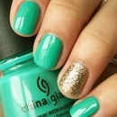Turquoise nails with gold glitter
