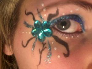 Just made this when I was bored. 
Thought I'd share :) 

used;
- Blue mascara
-Blue glitter liquid eyeliner
-black liquid eyeliner
-White liquid eyeliner
-blue eyeshadow
-blue flower stick-on gem