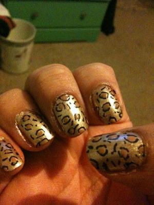 1. Base coat color of your choice
2. Using a nail pen draw random dots, lines, and circles *Don't close the cirlces.... if that makes sense. They should look like two parenthesis ( )
3. Using a dotting tool (or whatever you like) dot a contrasting color inside the circles
4. Top coat :)