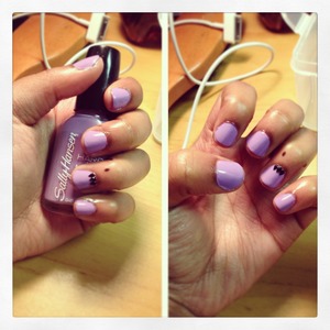 purple base with black pointed studs!
Sally Hansen Hard as Nails, No Hard Feelings