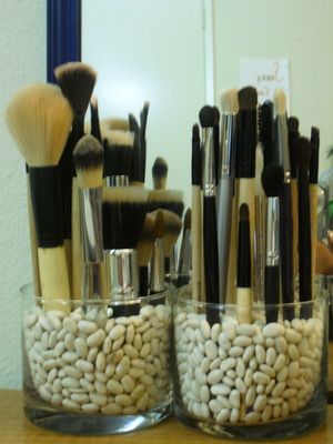 brush holder! so happy to finally get this finished! total money spent = $3 (glass containers x2 + floral foam + white beans)   :]