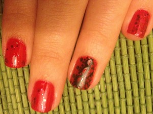 Orly nail lacquer; Red carpet. Orly nail lacquer; rockets red glare. Nail art; Black.
